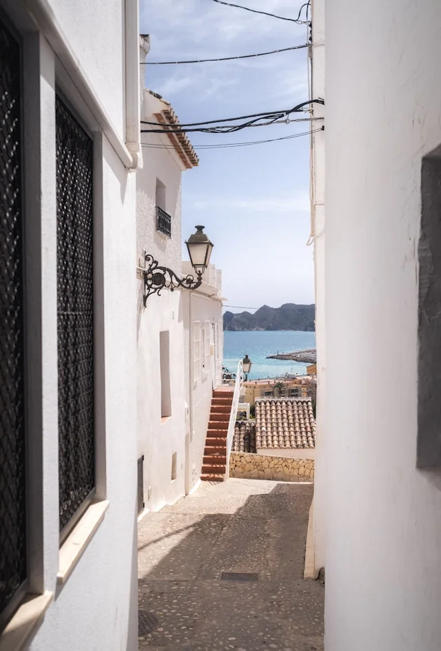 Whitewashed street opening to the sea
